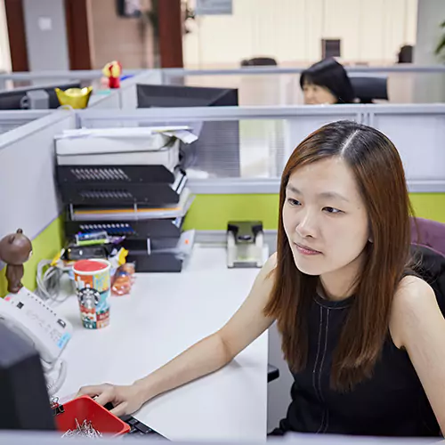 Woman working behind a computer