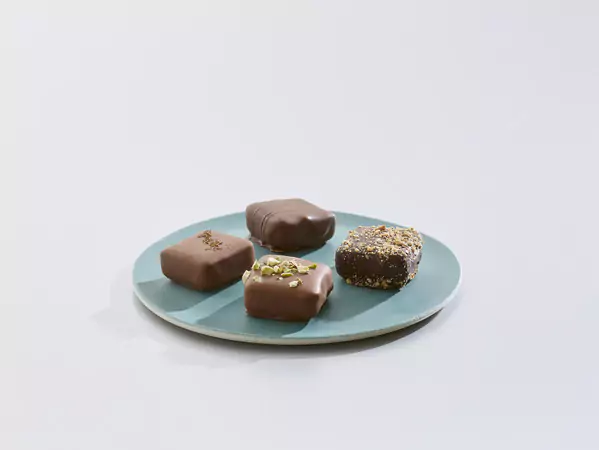 plate filled with four types of chocolate confectionaries