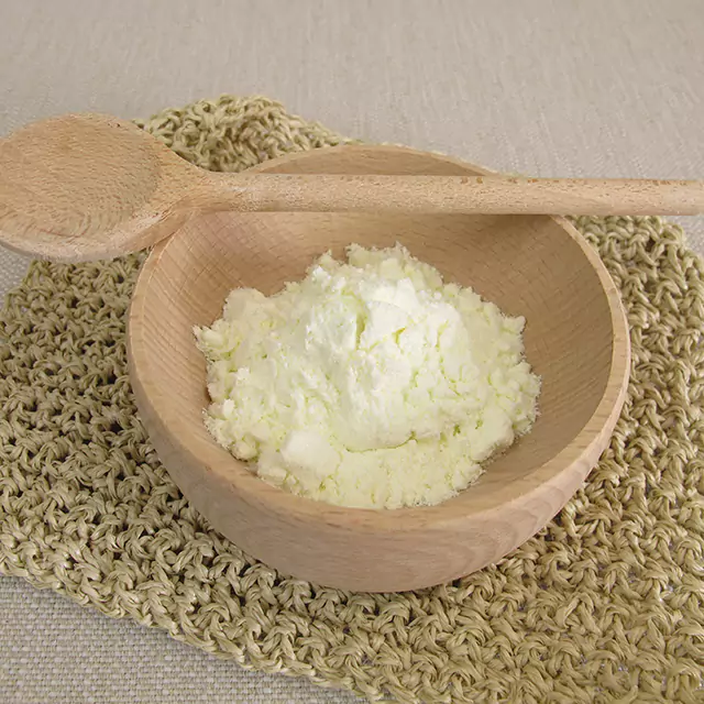 Buttermilk powder in a wooden bowl