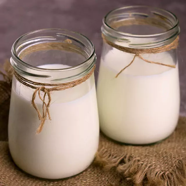 Two diary liquid concentrates in glass jars